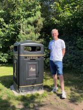 Councillor Johnson beside a jumbo bin