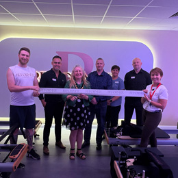 Reformer ribbon cutting photo