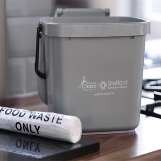 Food waste caddy in kitchen